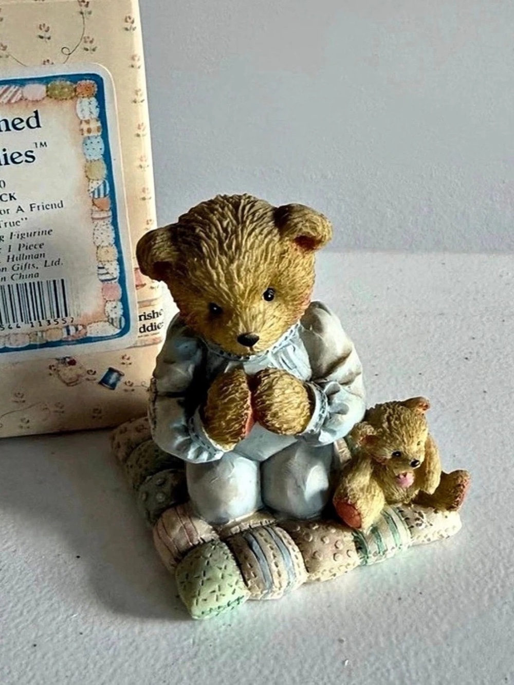 Cherished teddies praying near Patrick boxed